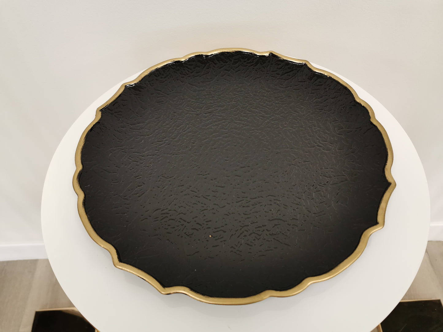 Black acrylic charger plate with gold rim, 13"